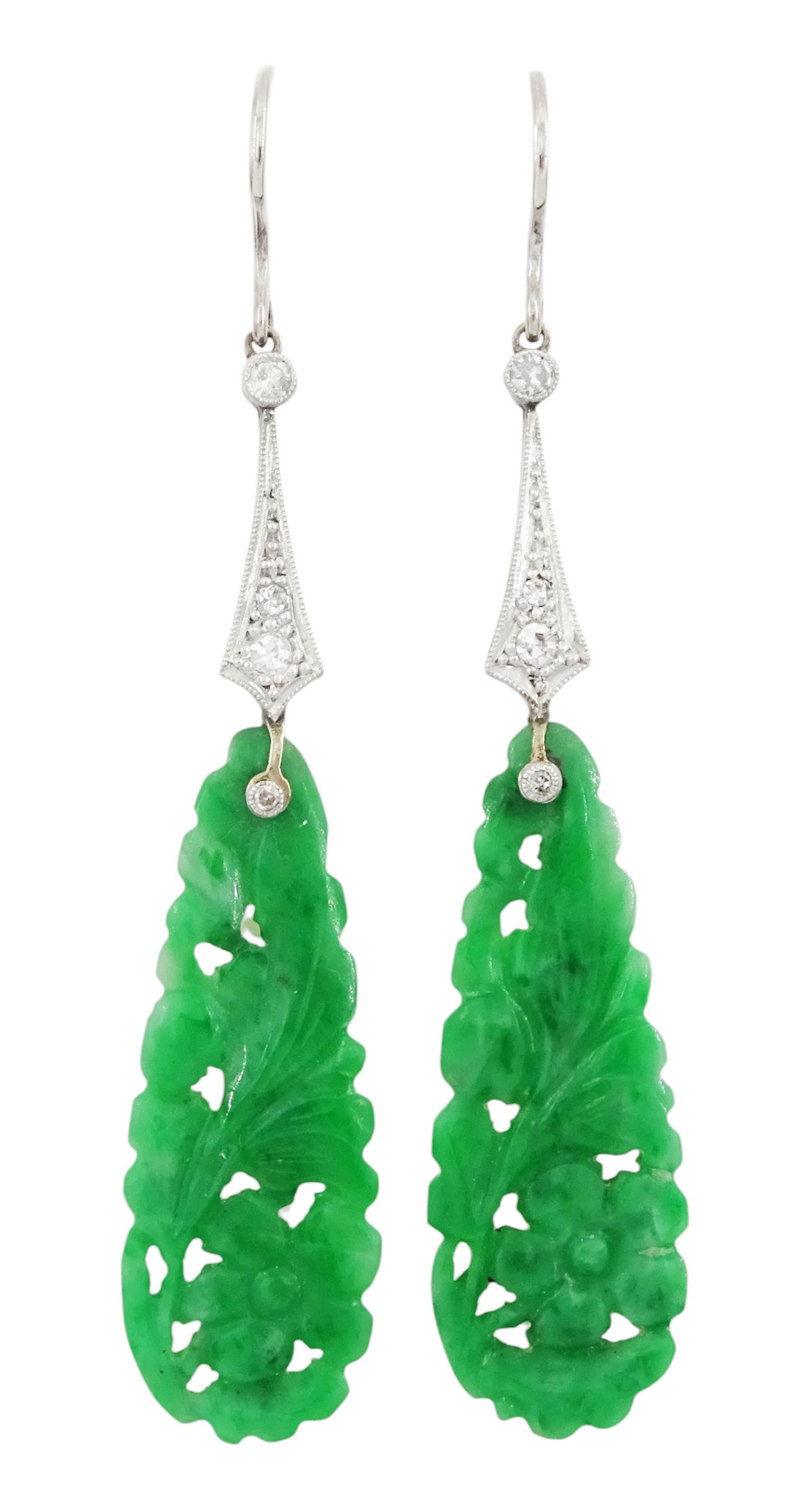 Pair of 18ct white gold Art Deco jade and diamond earrings, the pear shaped jade panels, with carved foliate decoration, suspending from milgrain set single and old cut diamond pendants, in velvet and silk lined box by Prouds Ltd, Sydney