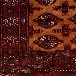 Afghan Bokhara dark amber and terracotta ground rug, decorated with Hac and Gul motifs  within multiple geometric guard bands
