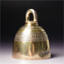 Late Victorian silver gilt table bell with reeded and roundel decoration and loop handle, bell and clapper both hallmarked H7cm London 1900 Maker R & S Garrard & Co