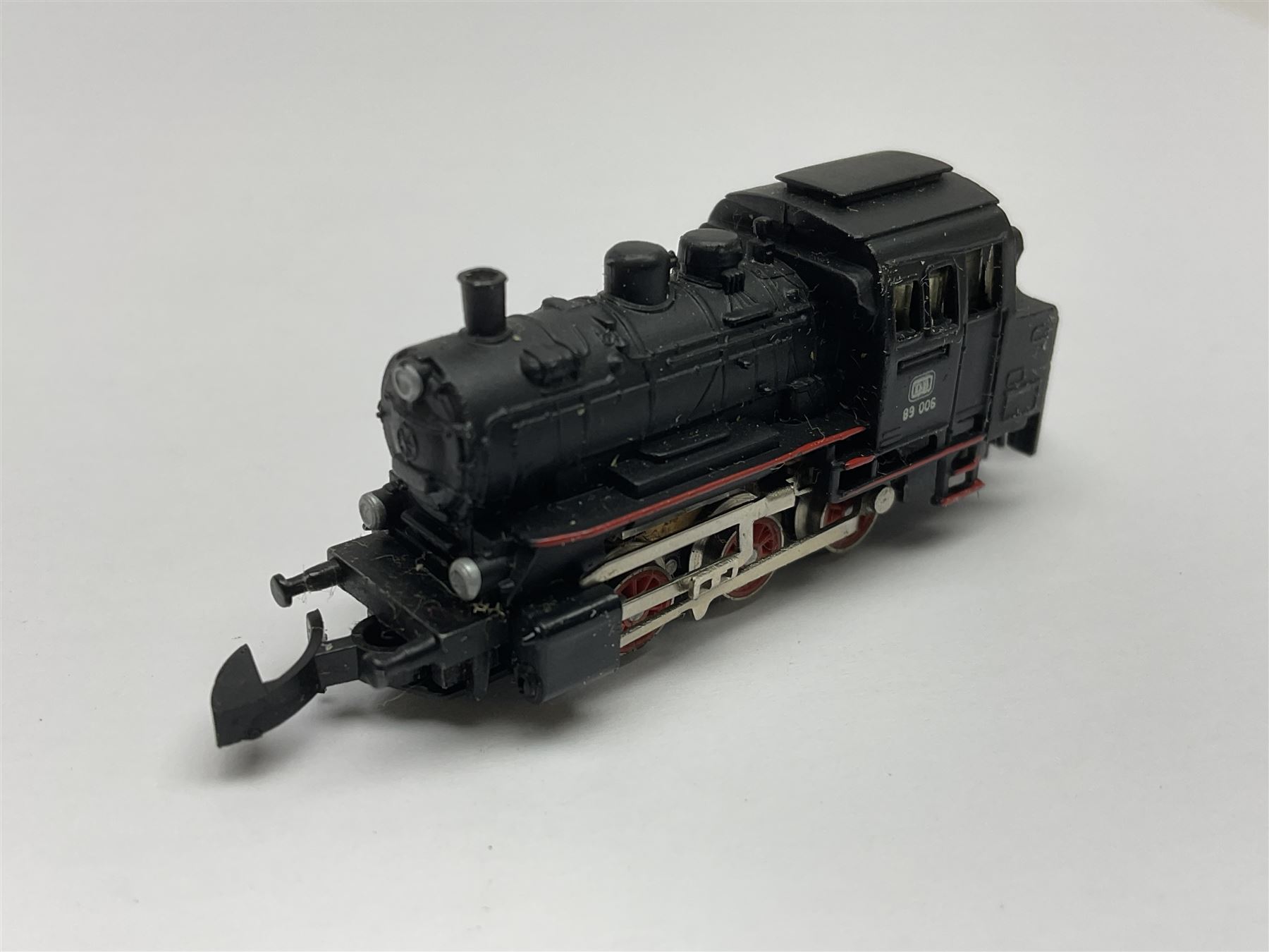 Marklin mini-club 'Z' gauge - DB Diesel Co-Co type locomotive; DB 0-6-0 Rangierlok type shuttle locomotive probably no.8864; and another DB 0-6-0 locomotive probably no.8800; together with an unmarked DB 4-6-2 tender locomotive and DB 2-6-0 tender locomotive; all unboxed (5)