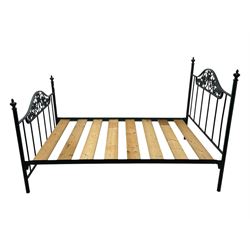 Contemporary metal double bed frame, shaped head and footboards with foliate cast panels and vertical rod supports, the corner posts with urn-shaped finials, finished in a mottled verdigris-style green, with pine slatted base