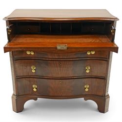 Quality Georgian design mahogany serpentine secretaire chest, the shaped top with moulded edge, fitted with cock-beaded secretaire drawer with button-release fall-front enclosing fitted interior, over three graduating drawers with brass drop handles on pierced circular plates, the canted uprights carved with blind-fret strapwork, lower moulded edge on shaped bracket feet