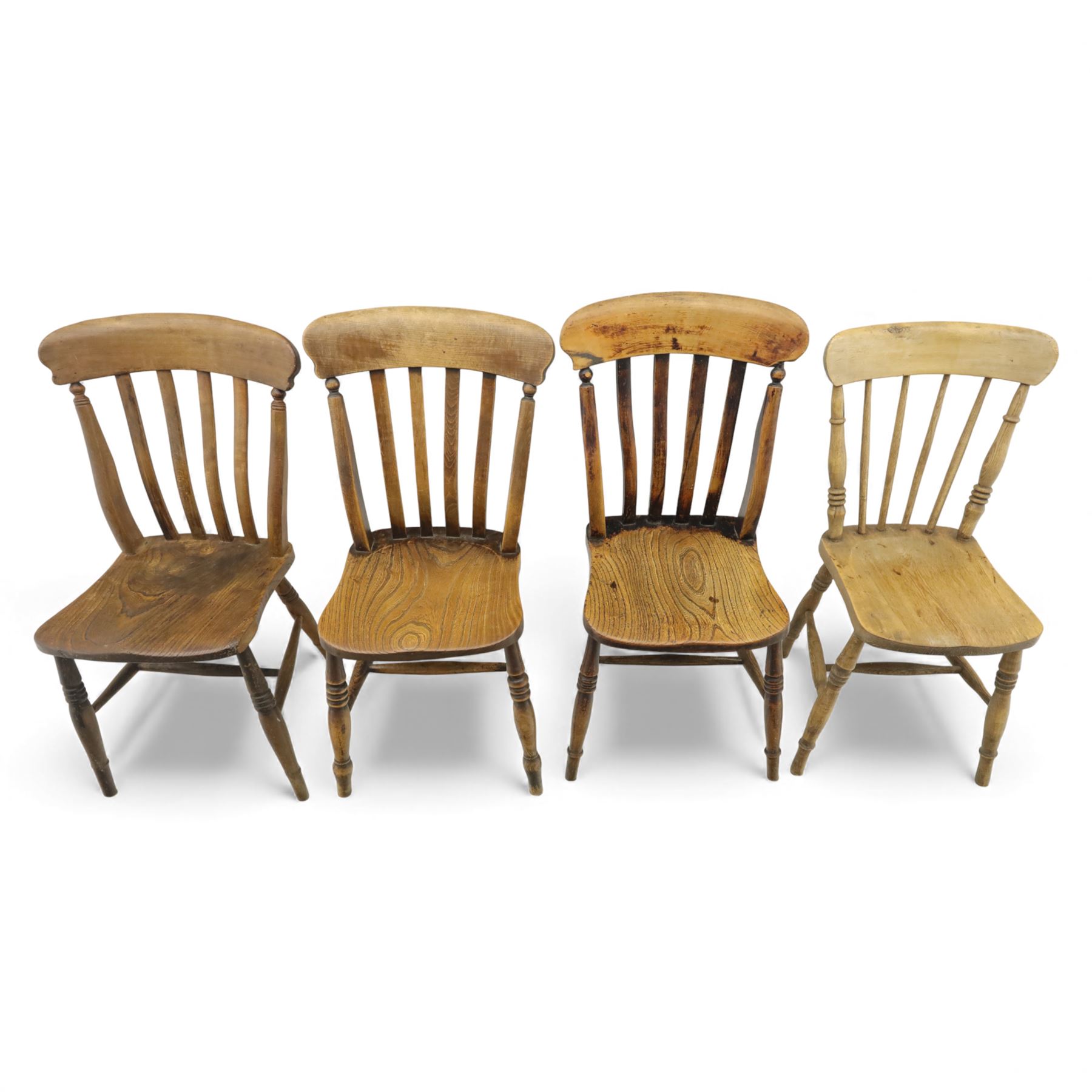 Eight Victorian farmhouse chairs in elm and beech, spindle-back frames with moulded seats, on turned and plain supports