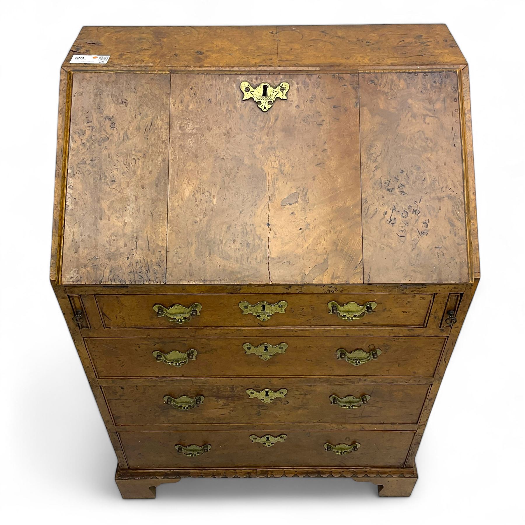 George III figured walnut bureau, fall-front enclosing central cupboard, six pigeonholes and six drawers, fitted with four graduated cockbeaded drawers, on bracket feet