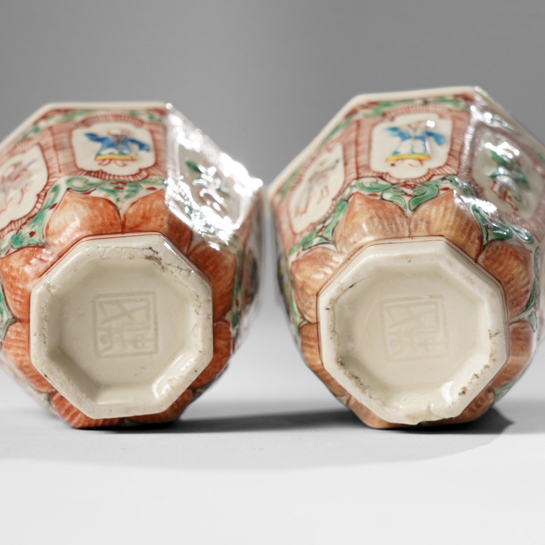 Pair of Chinese Kangxi period Blanc de Chine octagonal 'Immortals' beakers, Dehua, enamelled in Europe, Shi Zhongtun mark to base, H6.5cm (2)