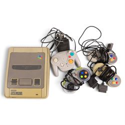 Super Nintendo Entertainment System console, three controllers including a Sprint Pad, a Nintendo Game Cube controller and a collection of SNES games, comprising Mystic Quest Legend, Flashback, Super Swiv, Eek The Cat, Street Fighter II, Dragons Lair, Jurassic Park Part II, Equinox, Donkey Kong Country, Super Mario World, Stunt Race, Super Tennis, Primal Rage, Alien 3, Starwing and F-Zero, all unboxed 