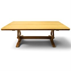 Acorn Industries - oak dining table, rectangular top with rounded corners and chamfered edge, raised on twin lyre-shaped supports united by pegged stretched on sledge feet, carved with acorn signature to stretcher, by Alan Grainger, Brandsby