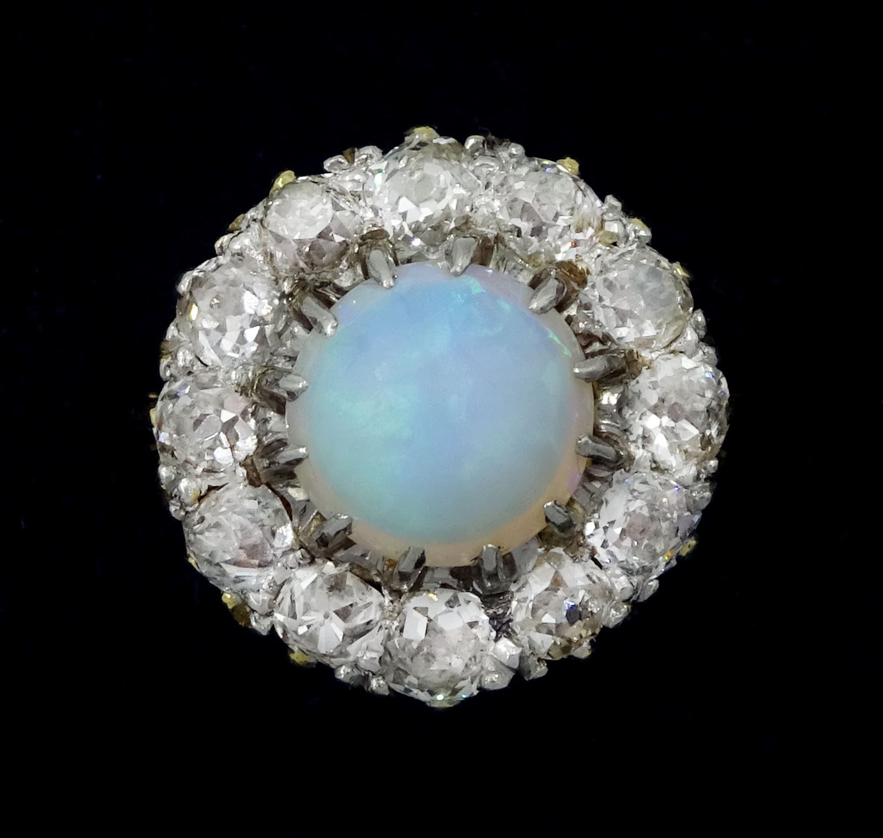 Early 20th century opal and old cut diamond cluster ring, stamped 18ct Plat, total diamond weight approx 1.00 carat