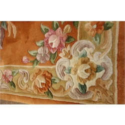  Small Chinese washed woollen rust ground rug with traditional floral pattern, 155cm x 78cm  