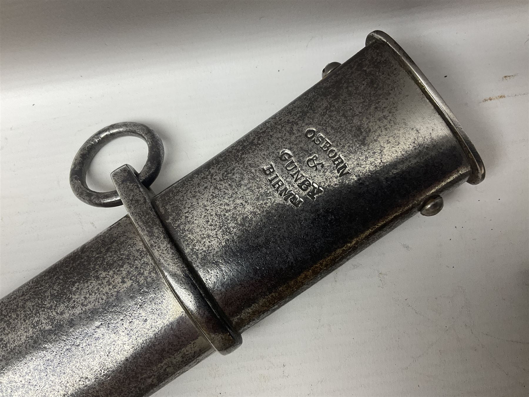 British 1796 Pattern Light Cavalry trooper's sword, the 84cm curving fullered blade stamped Hadley.1 to the back edge, steel hilt with knucklebow, D-shaped langets and leather grip; in polished steel scabbard stamped Osborn & Gunby Birmm. and W.R.16 ( ?16th Light Dragoons) with two suspension rings L100cm overall