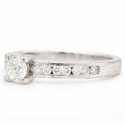 18ct white gold diamond ring, four claw set with a single round brilliant cut diamond of approx 0.40 carat and diamond set shoulders, London 2011