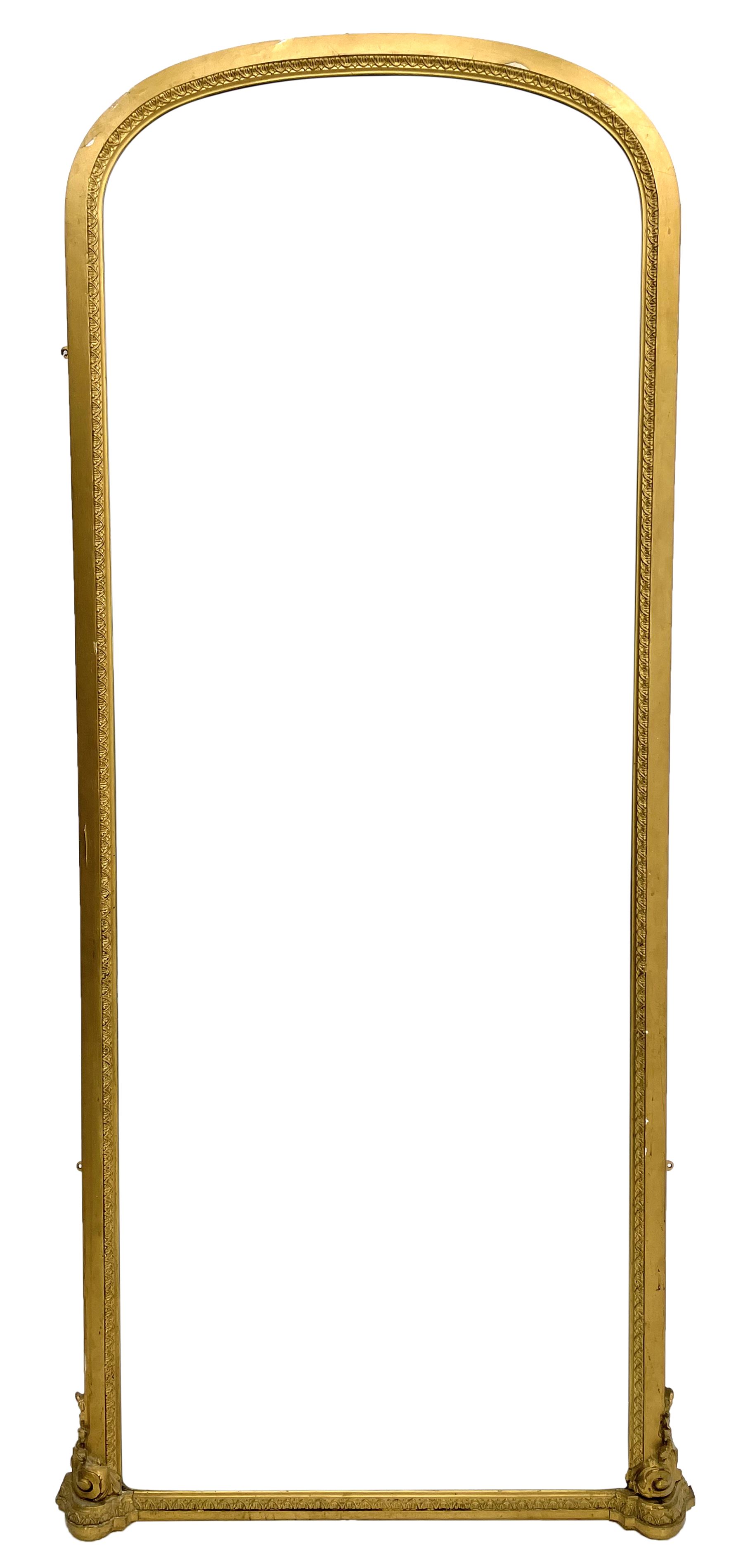 Tall Victorian hall mirror, in arched gilt frame with foliate mould slip, acanthus scroll corner brackets 