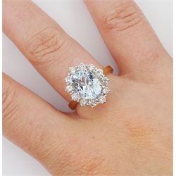 18ct gold oval cut aquamarine and round brilliant cut diamond cluster ring, hallmarked, aquamarine approx 2.55 carat, total diamond weight approx 0.85 carat
