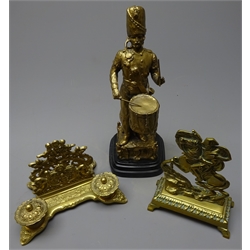  Cast bronze figure of a soldier drummer on polished stone base H30cm, a cast brass fireside ornament as Napoleon on a rearing horse and a modern brass desk stand with two ink wells and letter rack(3)  
