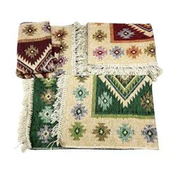 Three Turkish rugs decorated with geometric medallions and tasseled edges, L84cm, W54cm
