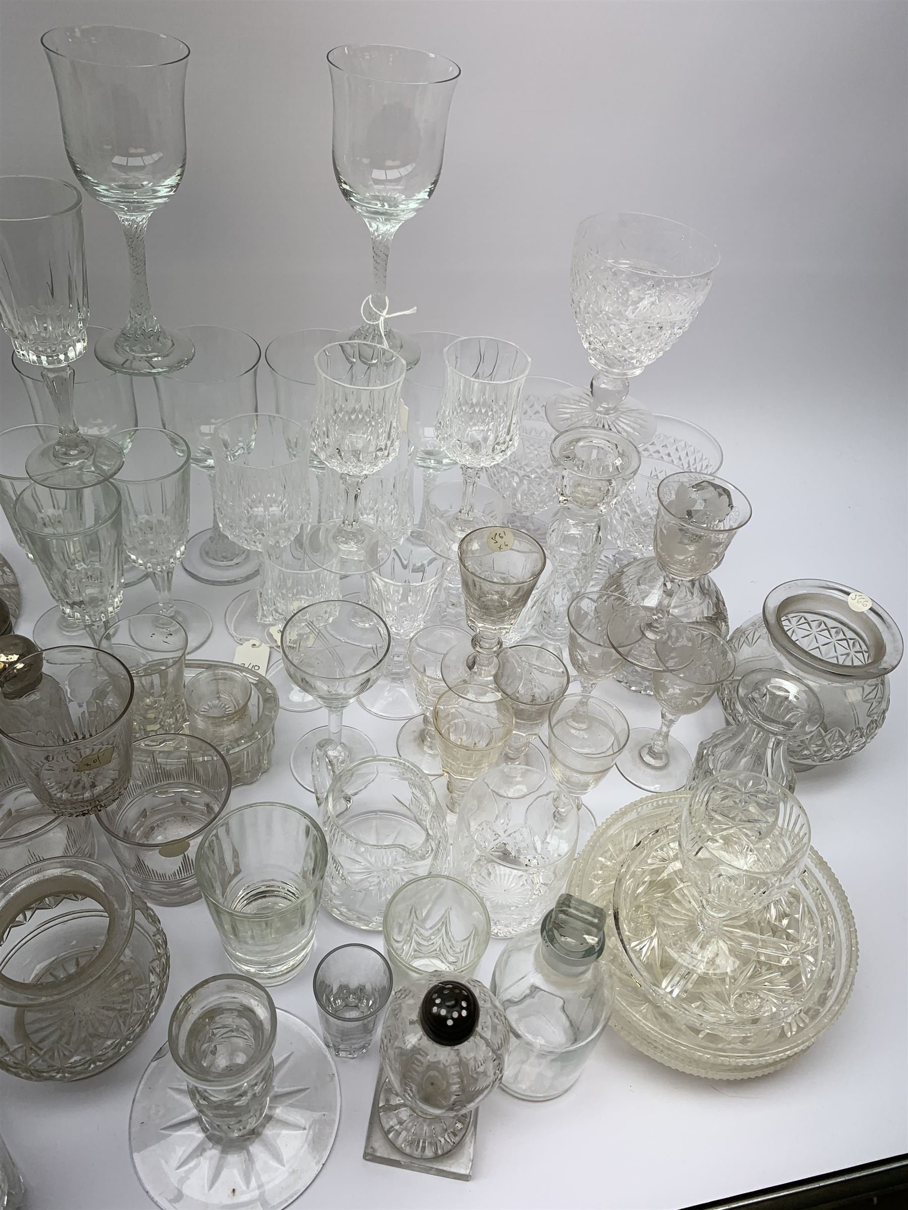 A number of Victorian tumblers and Edwardian drinking glasses, together with a large quantity of other later glassware, to include a glass table lamp base, drinking glasses of various forms, a number with cut decoration, other assorted cut glass including jug, vases, jars and covers, etc. 