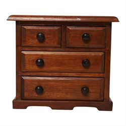 Table top chest of draws, fitted with three draws, upon a skirt base, together with another table top chest 