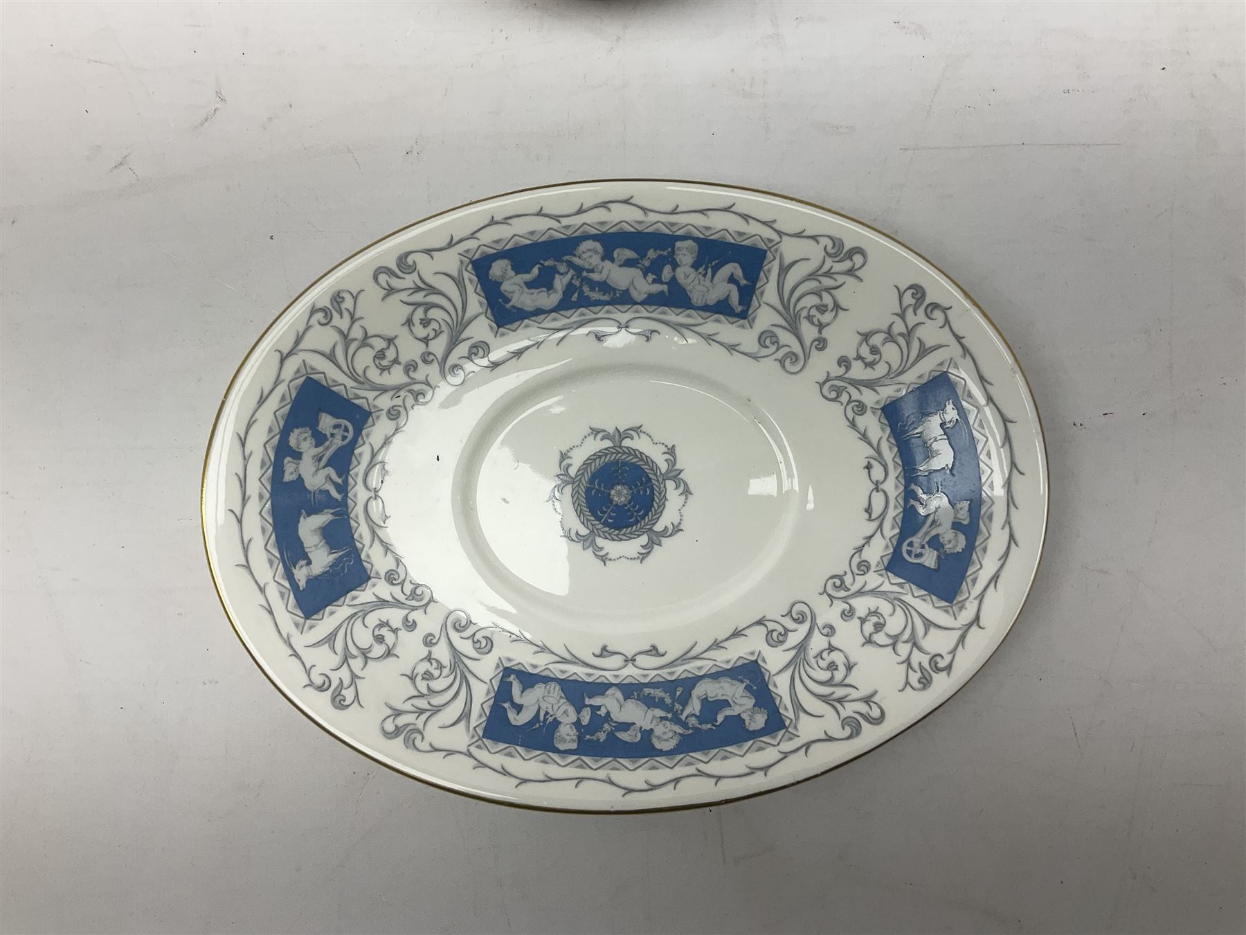 Coalport Revelry pattern tea and dinner wares, comprising nine dinner plates, four salad plates, eleven side plates, sauce boat and stand, ten teacups and ten saucers, and preserve pot and cover, together with a Coalport plate of shaped form decorated with pink roses, and a Royal Crown Derby Royal Antoinette pattern trio