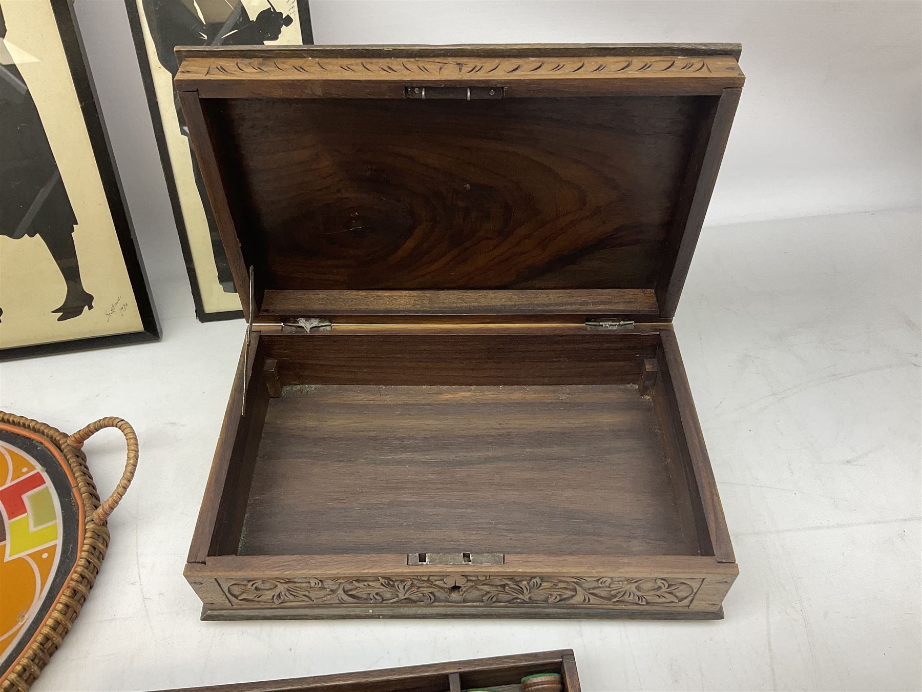 Two Scott-Ford framed silhouettes, featuring the standing profile study of a man dated 1929 and a pair of women dated 1929 and 1930, together with a box containing wooden chess pieces and a serving tray 