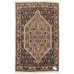 Small Persian Bidjar rug, the field decorated with floral Herati motifs, within floral design borders and guard stipes 