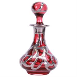 Cranberry glass scent bottle with silver overlay, together with German fluted vase with silver overlay upon a blue ground and similar teacup