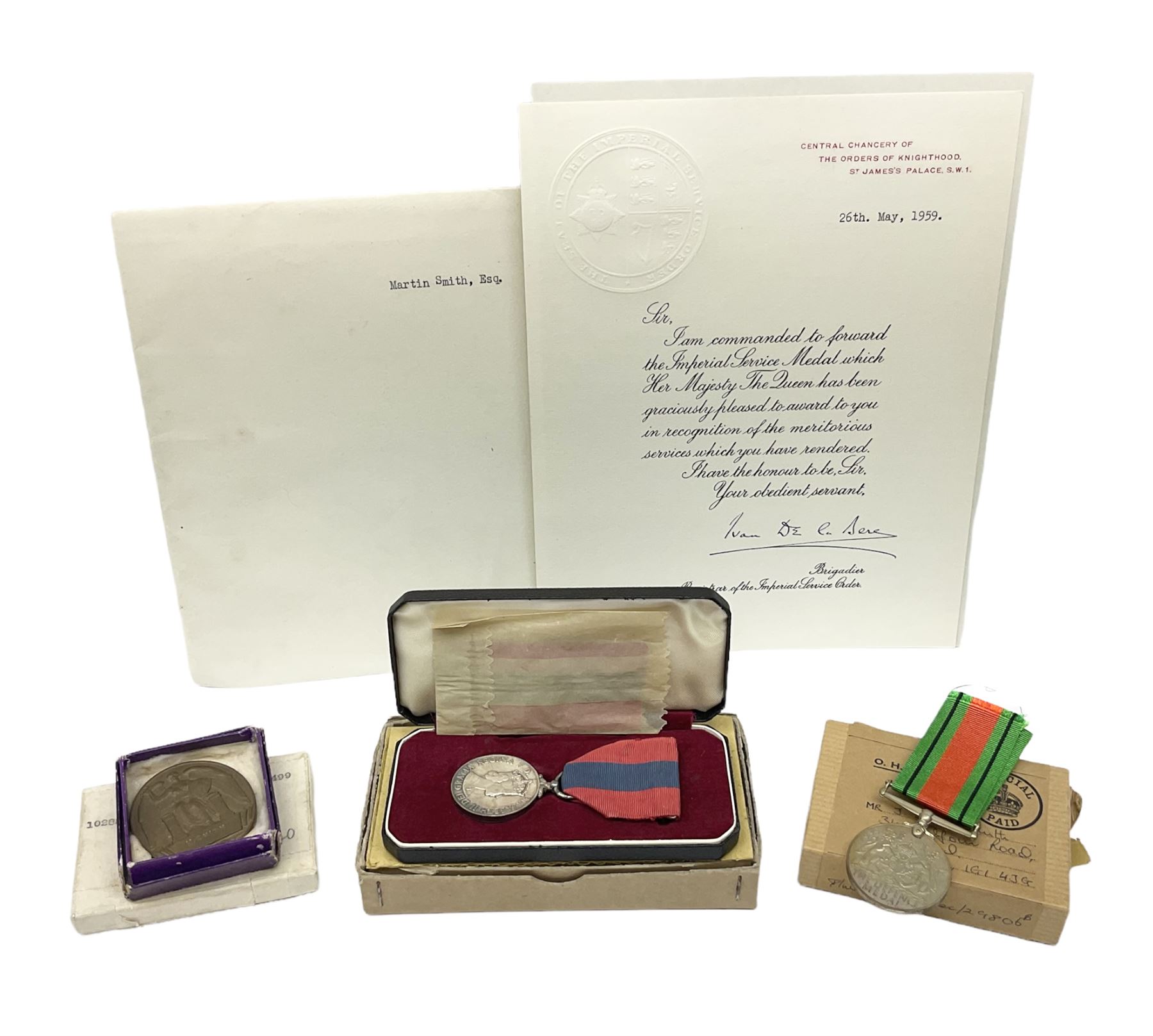 WW1 group of three medals comprising British War Medal and Victory Medal in issue box and Ceylon Volunteer Service Medal awarded to 10288 Pte. M. Smith R. Fus.; together with a later awarded WW2 Defence Medal in modern box with slip; and his QEII Imperial Service Medal in case and box with certificate dated 1959