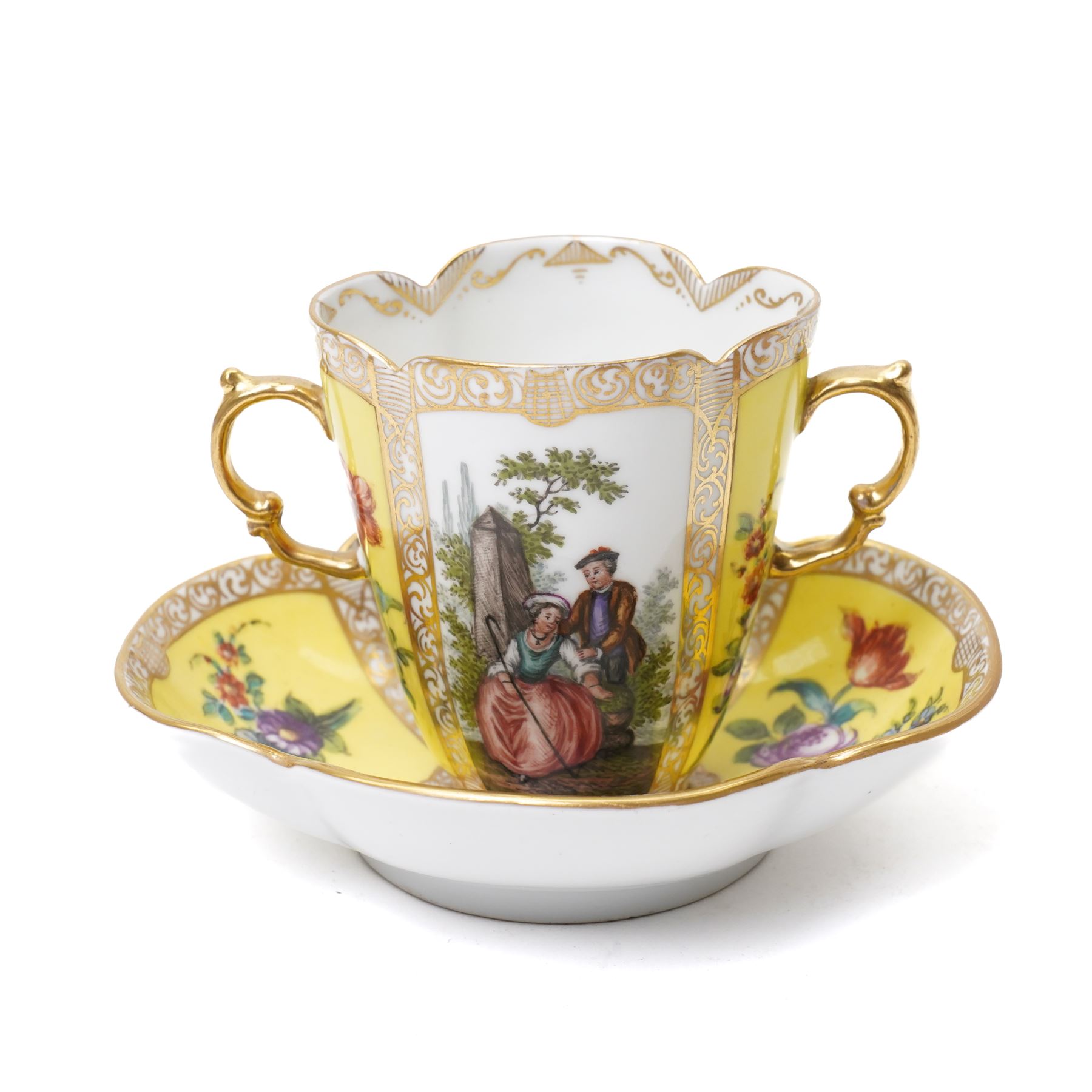 Two 19th century Dresden quatrefoil twin handled chocolate cups and saucers, decorated with Watteau style panels, with pink and yellow floral ground and gilt heightened decoration, blue 'AR' mark to underside for Helena Wolfsohn (2)