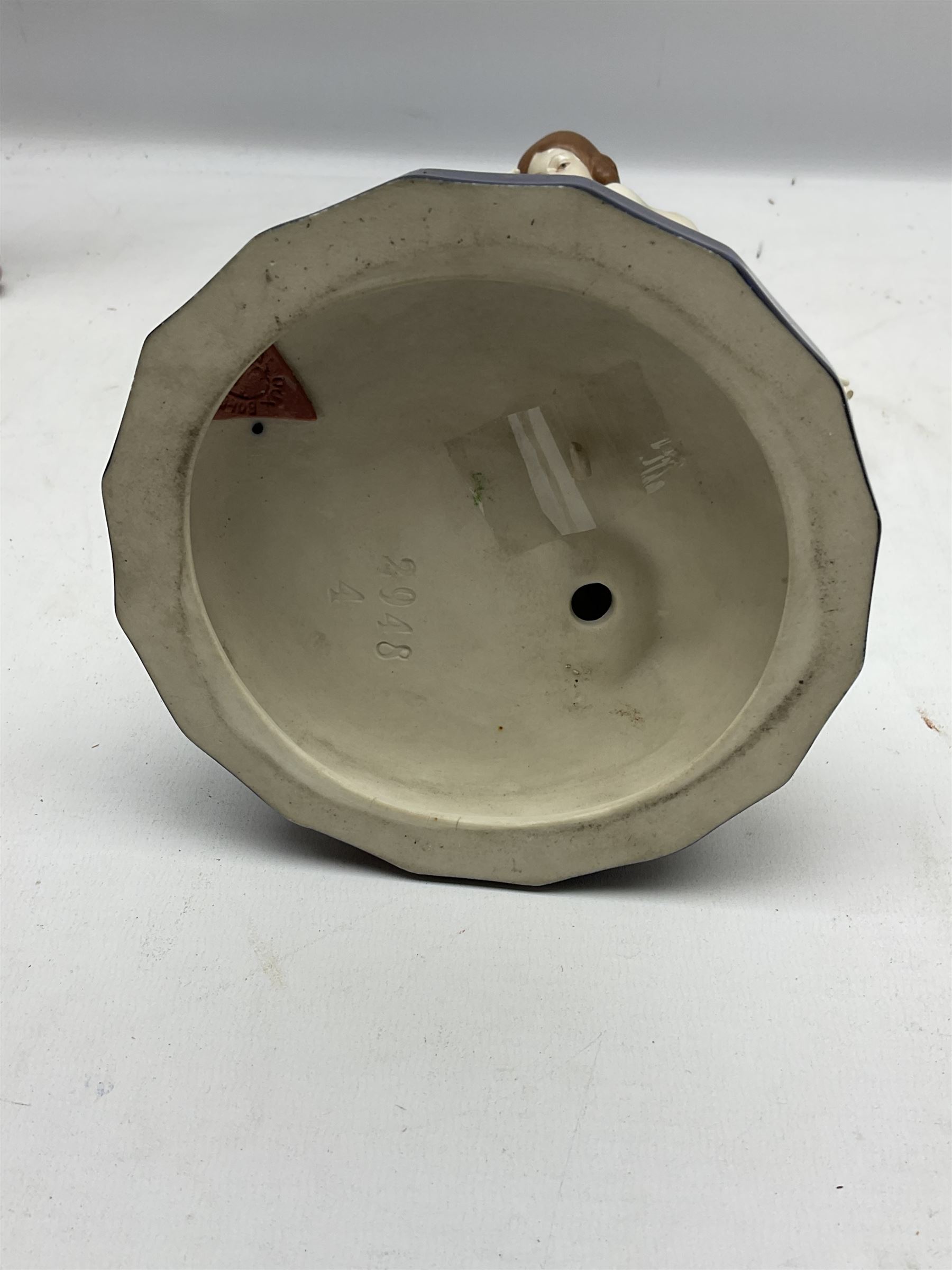 Royal Dux Art Deco figure group of Turkish dancing girl with a young boy beside her holding a casket, decorated with gilding, raised upon scalloped edge plinth base, with applied pink triangle and impressed 2948 beneath