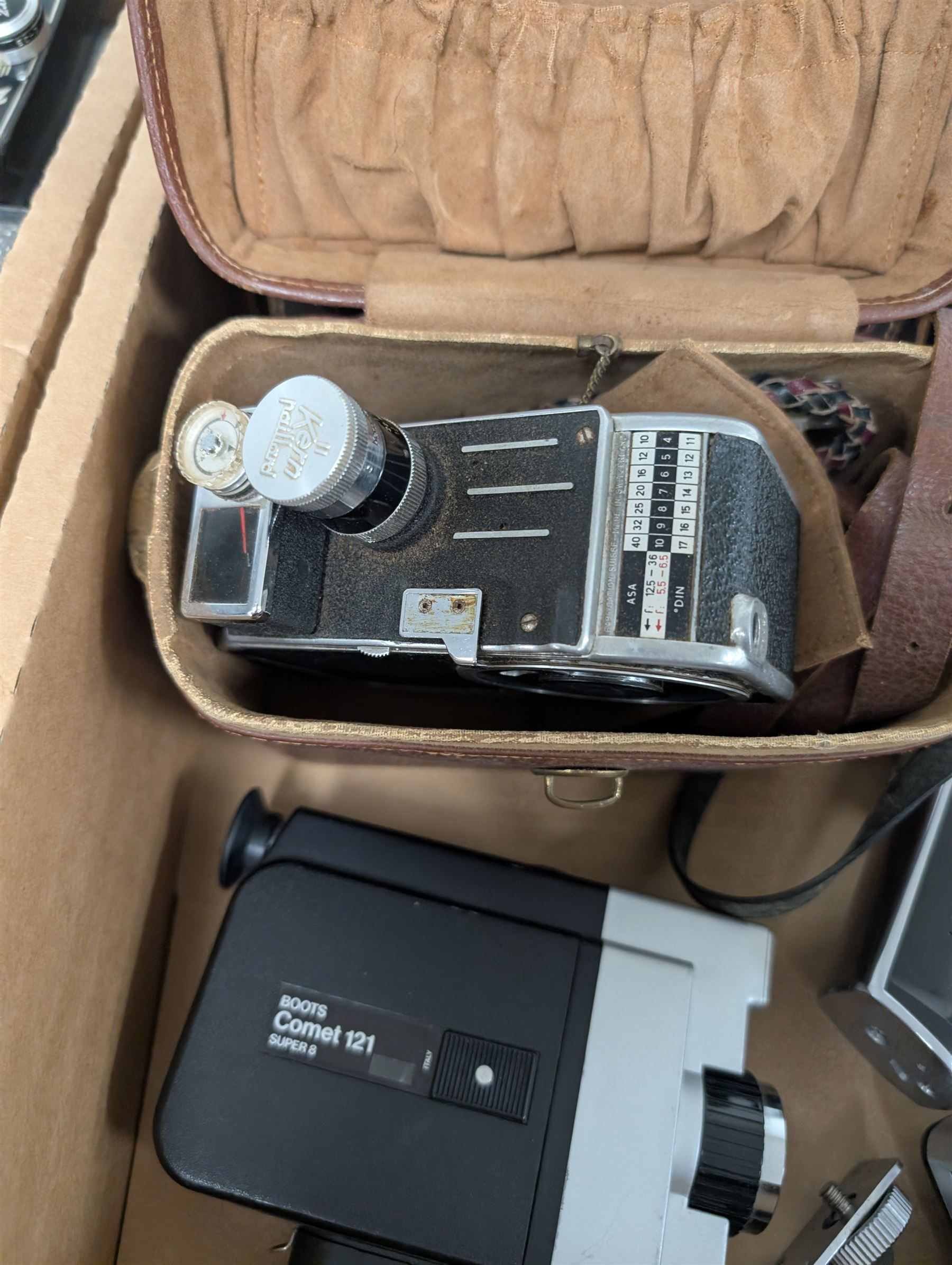 Collection of vintage cine cameras, including Bolex Paillard B8L, Mansfield Holiday Meter Matic, Quarz, Bell & Howell Autoset, Sankyo Super Micro, Canon Demi C, Agfa Movexoom, etc