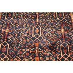 Large Persian indigo ground Herati runner rug, the busy field decorated with repeating geometric and Herati motifs in contrasting tones, enclosed by multiple guard stripes