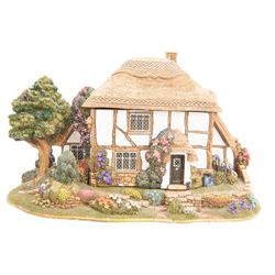 Eight Lilliput Lane models, comprising Heritage Collection Buckingham Palace, Crown Inn, Anne Hathaway, Periwinkle Cottage, Royal Oak Inn, Through The Keyhole, Burley Street Garage and The George Inn