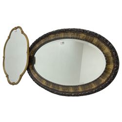 Shaped gilt framed wall mirror decorated with shell motifs (61cm x 45cm); and an oval framed wall mirror (79cm x 51cm)