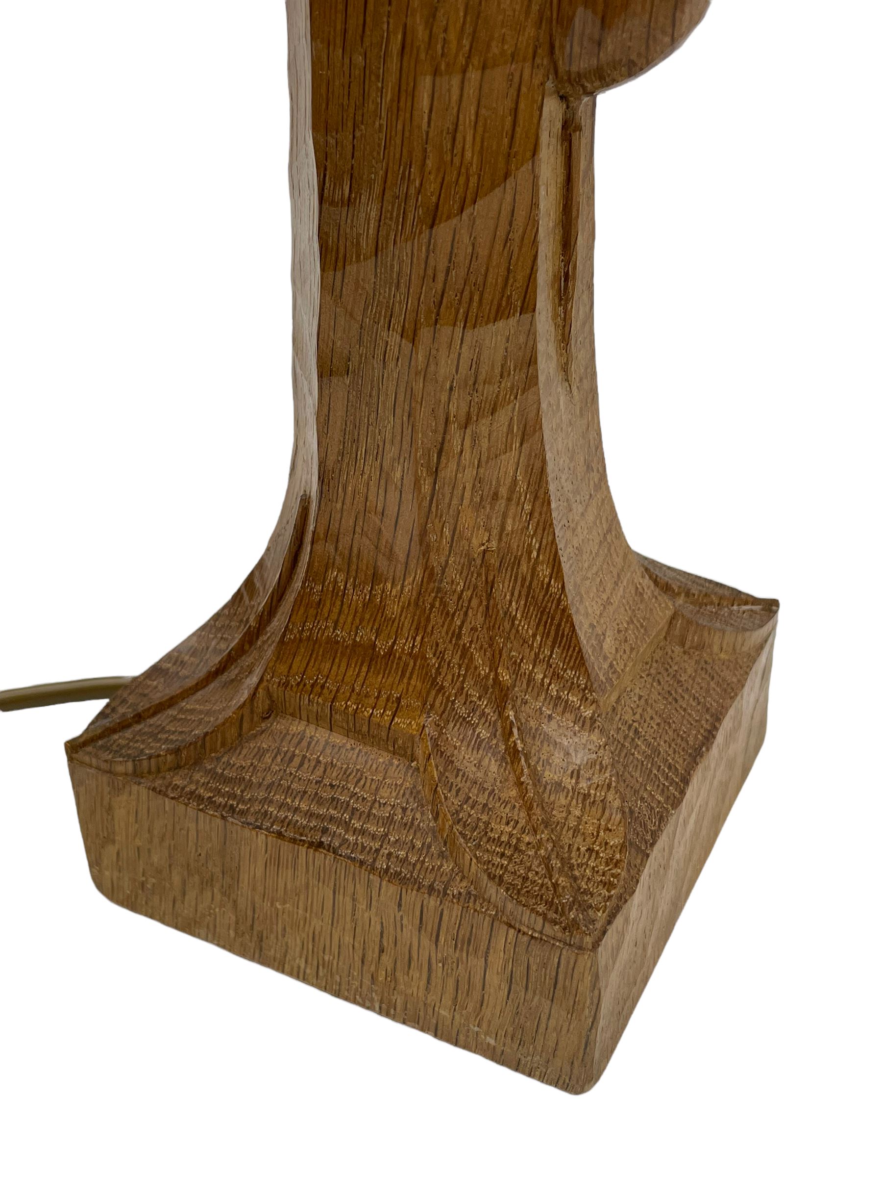'Mouseman' tooled oak table lamp, the octagonal tapered stem carved with mouse signature, with shade, by Robert Thompson of Kilburn
