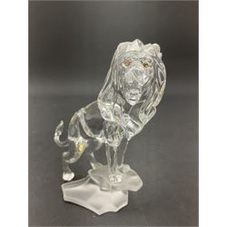 Swarovski Crystal animals, comprising camel and lion, both upon frosted crystal bases, together with Swarovski Crystal palm tree, upon similar frosted crystal base, tallest H14cm