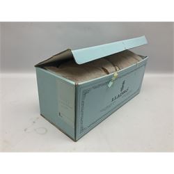 Lladro figure, Bedtime, modelled as a young girl reaching for her pet cat upon grandfather clock, sculpted by Vincente Martinez, with original box, no 5347, year issued 1986, year retired 1998, H28cm