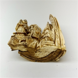 19th century Japanese carved mammoth ivory figure group, modelled as Fukurokuju and two attendants, carved verso with prunus, H17cm