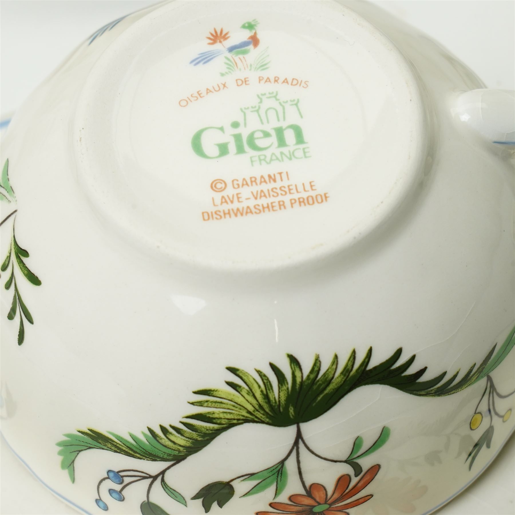 Gien France faience tea and dinner service in the 'Oiseaux de Paradis' pattern comprising six dinner plates, eight dessert plates, eight soup bowls, four cups, six saucers, oval plate, milk jug and sugar bowl and cover