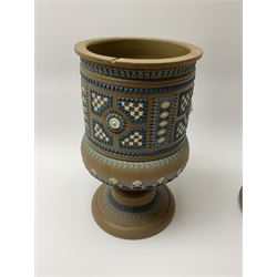 A late 19th century Doulton Lambeth stoneware water filter with original spigot, decorated with relief moulded foliate bands, with impressed marks and monogrammed for Laura Gooderham beneath, H34cm. 