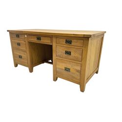 Light oak twin pedestal desk, fitted with seven drawers
