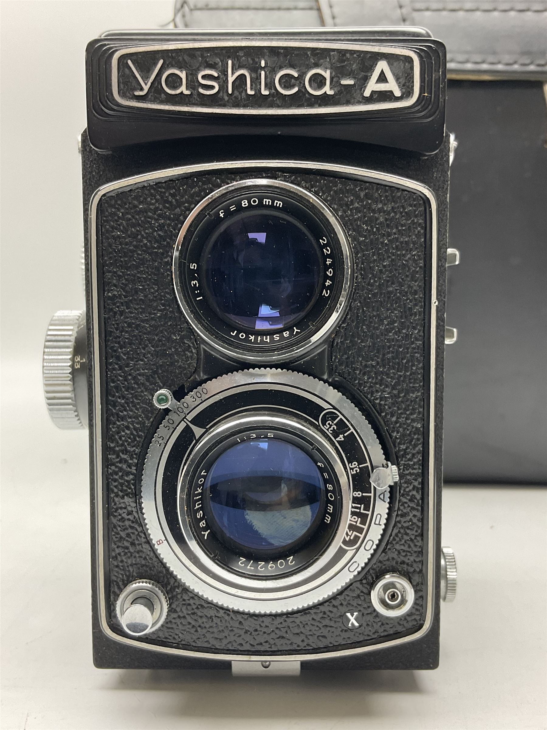 Yashica-A camera body, serial no. A4080073, with 'Yashikor 1:3.5 f=80mm' lens, serial no. 209272 and 'Yashikor 1:3.5f=80mm' lens, serial no 22942, together with Yashica TL-Electro camera body, serial no. 5054162 with 'Yashinon-DS 50mm 1:1.9  40056038