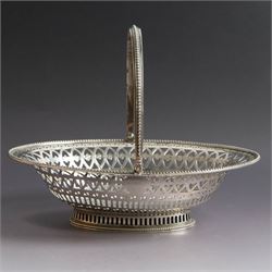 George III silver bon bon basket, of oval form with bead rim and swing handle, the sides with pierced latticework decoration, hallmarked Hester Bateman, London 1785, handle H14cm