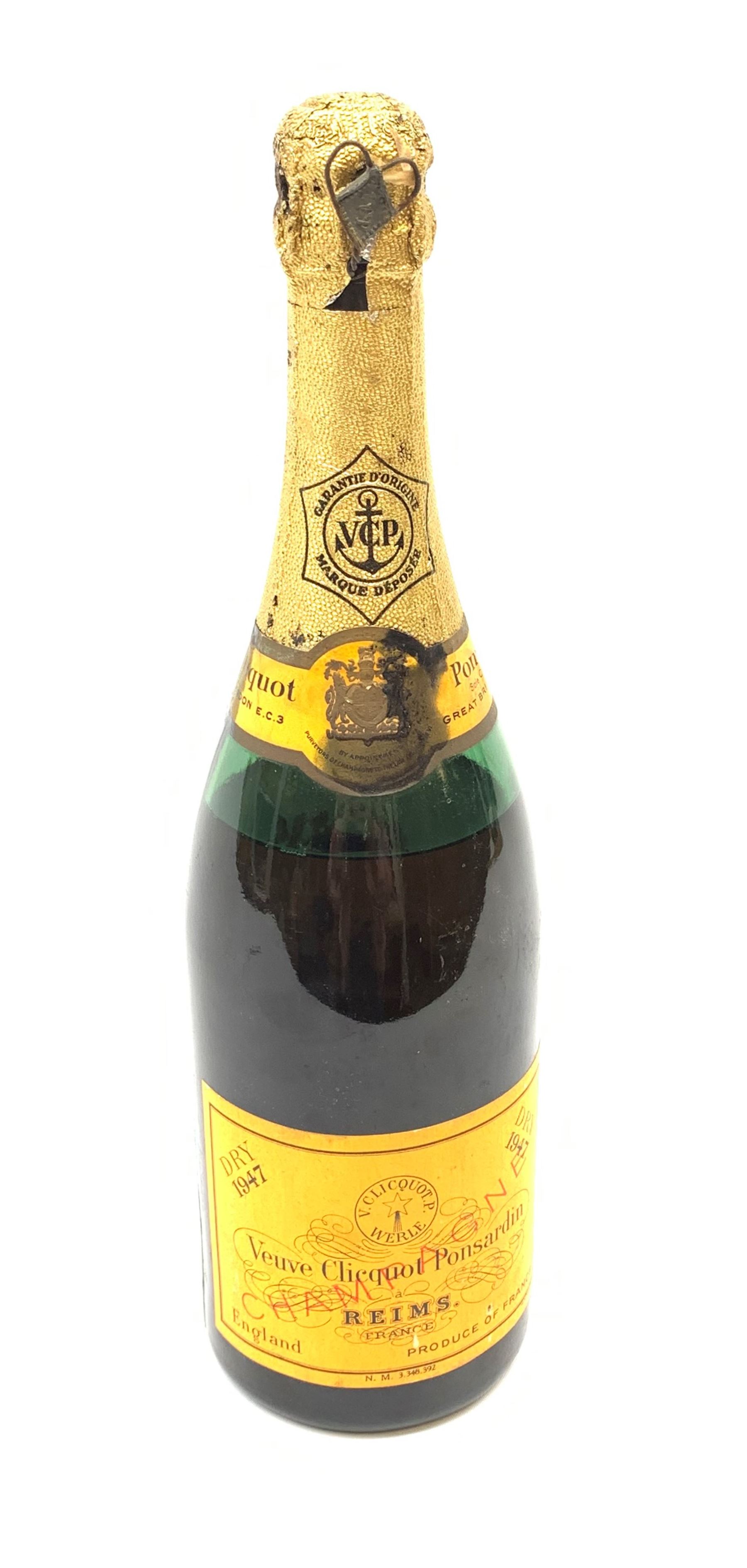 One bottle of Veuve Clicquot Ponsardin 1947 dry champagne, foil seal partially damaged, level below label
