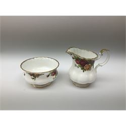 Royal Albert Old Country Roses pattern tea set, comprising teapot, coffee pot, six teacups and six saucers, five side plates, further teacup with joined saucer and side plate, open sucrier, milk jug, cake plate, and preserve pot and cover, together with Royal Albert Jubilee Rose pattern sauce boat and stand, and Royal Albert Lavender Rose pattern cake stand. 