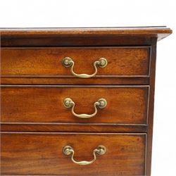George III mahogany chest, moulded rectangular top over five long cock-beaded drawers, each fitted with brass swan neck handles and circular plates, with shaped brass escutcheons, lower moulding over ogee bracket feet 