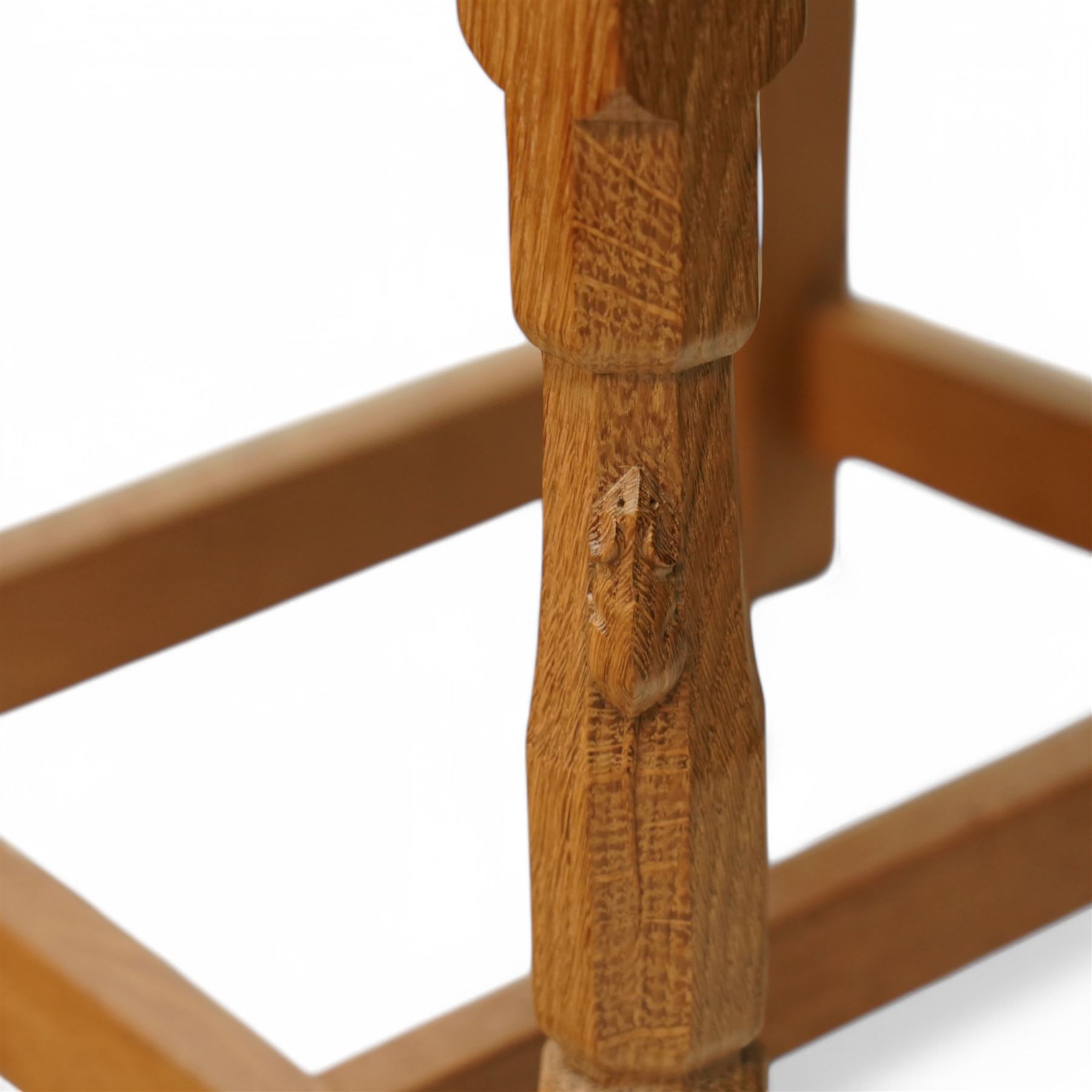 Mouseman - set of six oak dining chairs, pierced and carved lattice back over leather upholstered seat, on octagonal front supports united by stretchers, carved with mouse signature, by the workshop of Robert Thompson, Kilburn 