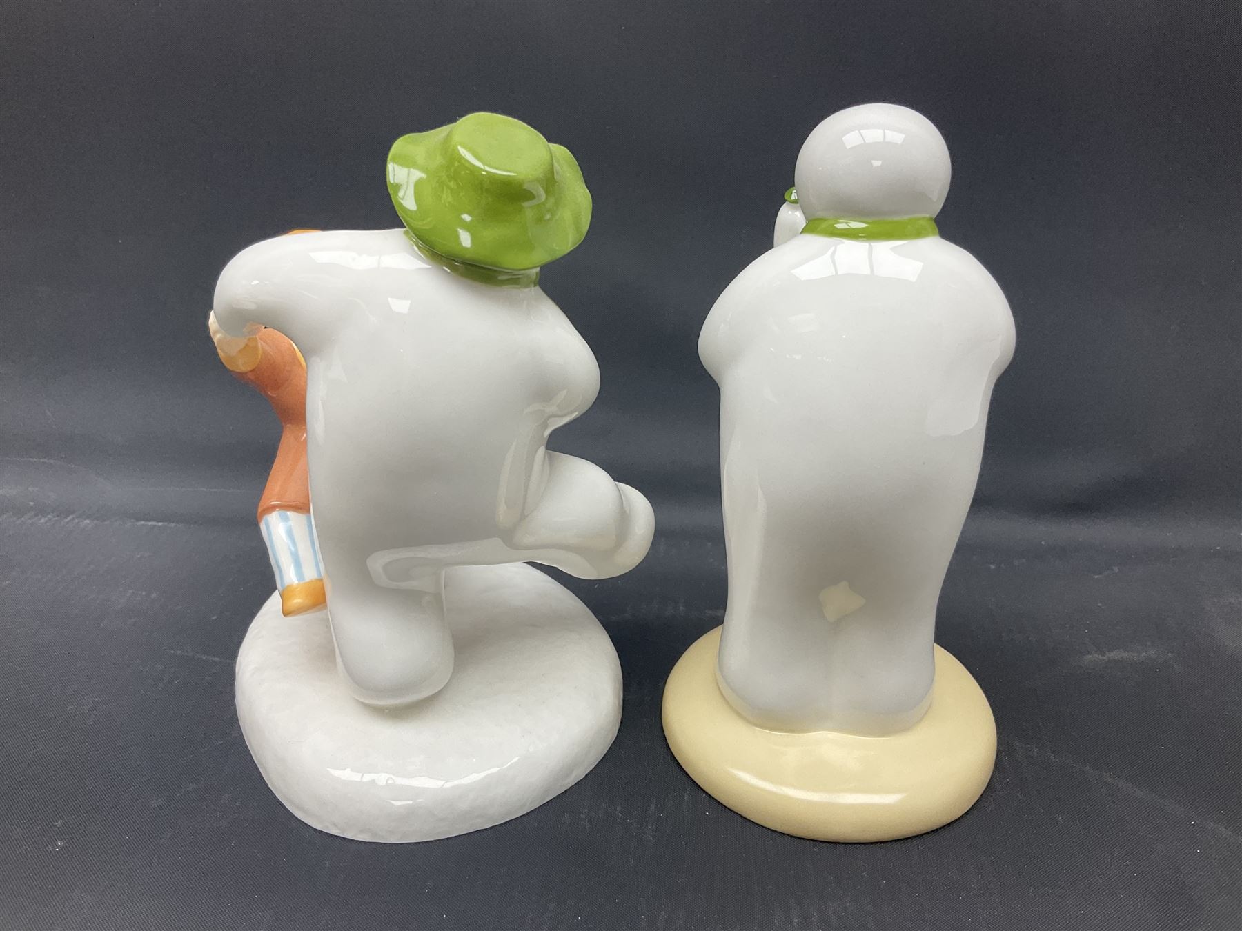 Four Coalport Characters The Snowman figures, comprising Snowman's Surprise, Christmas Cheer with certificate, The Bashful Blush and Dancing at the Party, all with original boxes 