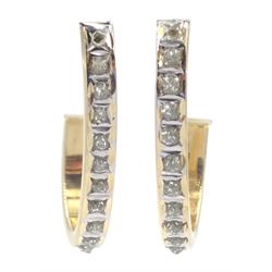 Pair of gold diamond half hoop earrings, stamped 14K