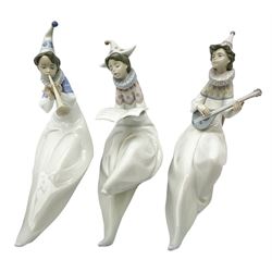 Lladro Young Jester set, comprising Mandolin no 6237, Trumpet no 6238 and Singer no 6239, all with original boxes, largest example H22cm