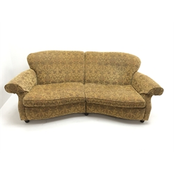 Three seat curved traditional sofa, scrolled arms, upholstered in a gold ground fabric with a floral pattern, W235cm, 