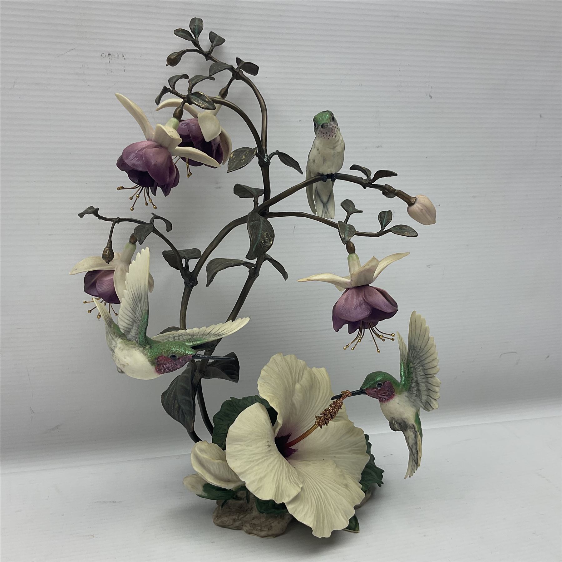 Franklin Mint House of Faberge, four humming bird figure groups, comprising Flight of Fancy, Beauty in Bloom, Splendor in the garden and The Enriched Garden, largest H35cm